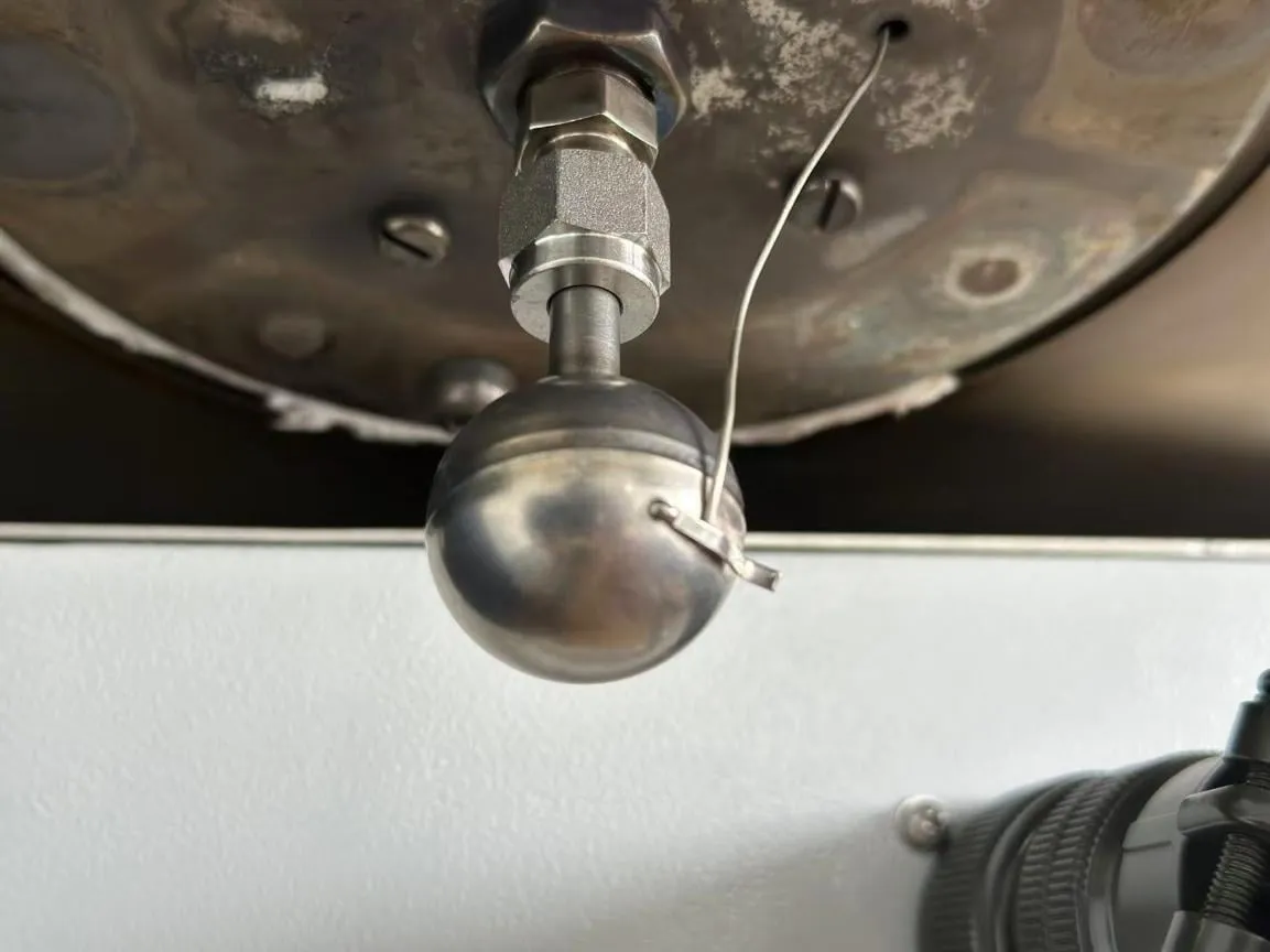 Spherical ARC sample bomb with a thermocouple clip inside the calorimeter chamber